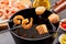 Dipping fresh salmon and prawns into a hot fondue