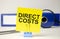 DIRECT COSTS - business concept, message on sticker on folder background with calculator