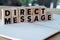Direct Message word written on wood block
