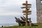 Direction arrows to the different popular towns with the distance to each city given in kilometers. Wooden signpost to Moscow,