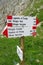 Direction indicator arrow on mountain pass in Dolomites