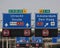 Direction and mandatory speed sign above motorway A20 with split between Rotterdam and to The Hague and Amsterdam via A13