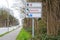 Direction sign shows Red Cross, parking symbol and German text Notaufnahme, meaning emergency department, at the road to a large