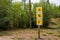 Direction sign on the trail in the forest, where there is a camping, lake, walking path for the tourist