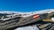 Directional path mark with Austrian flag painted on a rock on remote alpine dry meadow near Ladinger Spitze, Saualpe, Austria