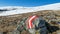 Directional path mark with Austrian flag painted on rock on the way to Ladinger Spitz, Saualpe, Carinthia, Austria,