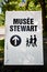 Directional signboard of Stewart Museum with a family drawing on it on St. Helen`s island, Montreal, Quebec, Canada