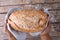 Directly above shot of cropped african american male hands holding baked bread loaf over table