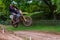 Dirt bike rider mid air after taking off from a jump