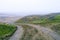 dirt muddy road wet Puddle countryside autumn fall green grass steppe after rain Tire tracks beautiful landscape Moldova