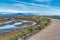 Dirt path amid wetlands and coastal dunes in scenic Bolsa Chica Nature Reserve