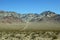 Dirt path leading to bare mountain, Nevada