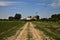 Dirt path in the middle of a field in the italian countryside in summer