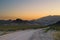 Dirt road across the desert, and into the hazy mountains near Uspallata, Mendoza, Argentina