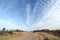 Dirt Road with Altocumulus Clouds