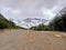 Dirt road in Andes snowy mountain range landscape. Forest track. Glaciers and Mountaineering. Landscape and extreme nature