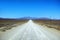 Dirt road in arid and barren highland in Savanna Desert in rural South Africa with copyspace. Dry, empty, remote land