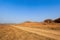 Dirt road in the autumn prairie