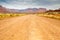 Dirt road through beautiful barren land