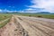 Dirt road & blue sky, Mongolian steppe