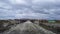 Dirt road crossing arid meadow landscape, tierra del fuego, argentina