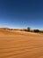 Dirt road in desert. Sand road to Sossusvlei Deadvlei. Lonely tree.