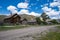 Dirt road filled with abandoned homes and buildings in Bannack Ghost Town in Montana