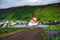 Dirt road going to the village of Vik and its church in Iceland