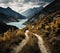 a dirt road going uphill towards a body of water