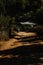 Dirt road leading through an isolated village in Myanmar, Burma