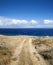 Dirt road leading to beach.