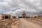 Dirt road leading to the concrete church of abandoned leper village of Sanatorio de Abona near Abades beach, east coast of