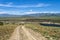 A dirt road leads to the Oakley Dam and Lower Goose Creek Reservoir in Oakley, Idaho, USA