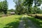 Dirt Road and Log Cabin