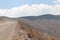 Dirt road lost between mountains. Streets of Purmamarca, Jujuy, Argentina. Mountains of incredible colors. landscapes