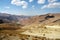 Dirt road and mountain scenery between Chaghcharan and the Minaret of Jam in Afghanistan