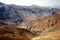 Dirt road and mountain scenery between Chaghcharan and the Minaret of Jam in Afghanistan