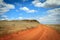 Dirt road orange prairie, going to the sky