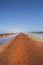 Dirt road at Pink lake Hut Lagoon at Port Gregory, Western Australia, Australia