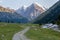 Dirt road and rapid Djuku river. Kirgizstan