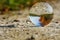 Dirt road, reflection in the glass ball, autumn