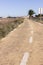 Dirt road in Spain, Canarian islands. Dividing centre line. Bicycle track