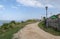 Dirt road on the street with lanterns and wooden fences on the bank of the Volga River in the village of Sviyazhsk, Russia