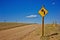 Dirt Road Street Sign with Bullet Holes