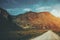 Dirt road surrounded by mountains