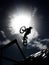 Dirtbike bmx rider jumps against sun