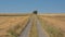 Dirtroad between meadows and fields in the wallonian countryside