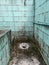 Dirty and abandoned squat toilet