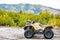 Dirty ATV with scenic background perfect for off road adventures