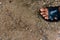 Dirty and bare child`s feet on gravel - Poor people and human po